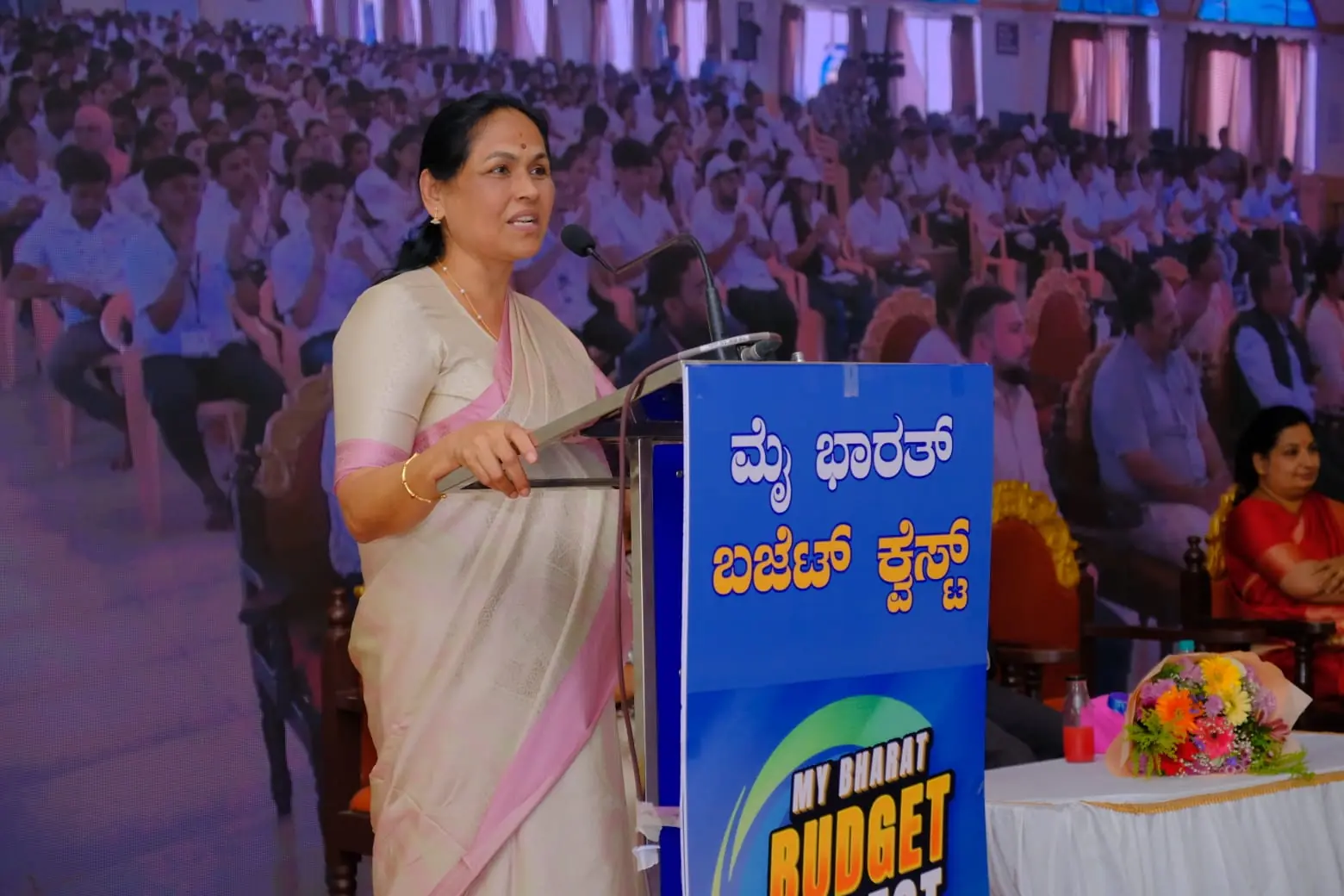 Smt. Shobha Karandlaje delivering a speech at the podium